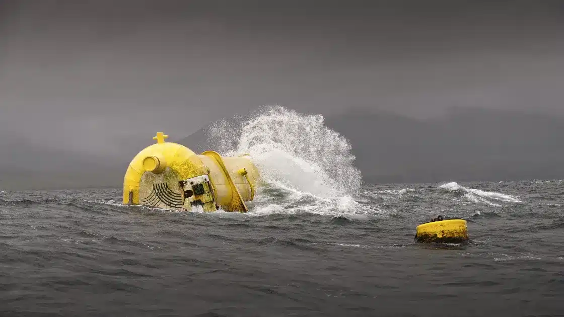 Oscillating Water Column device amidst ocean waves, showcasing wave energy technology.