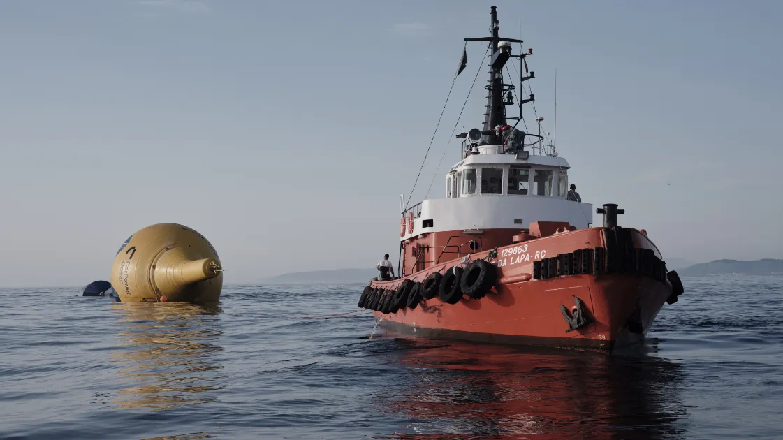 CorPower Ocean vessel deploying a wave energy converter in the ocean.